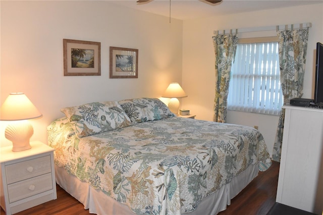 bedroom featuring ceiling fan and dark wood-type flooring