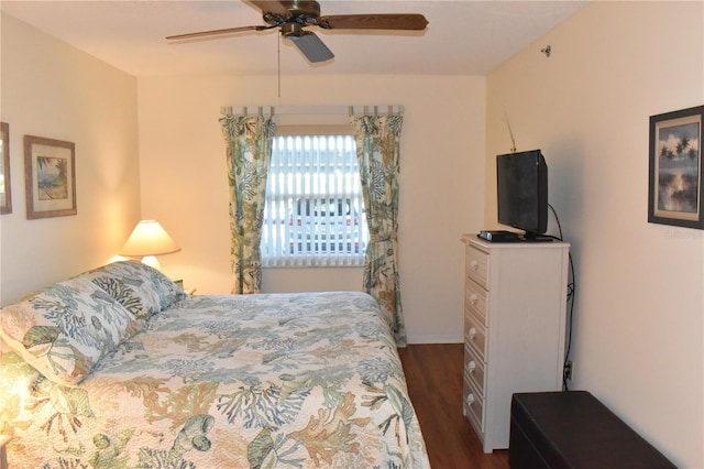 bedroom featuring ceiling fan and dark wood-type flooring