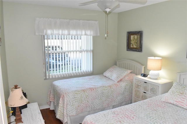 bedroom featuring dark wood-type flooring and ceiling fan