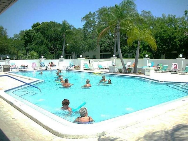 view of swimming pool featuring a patio area