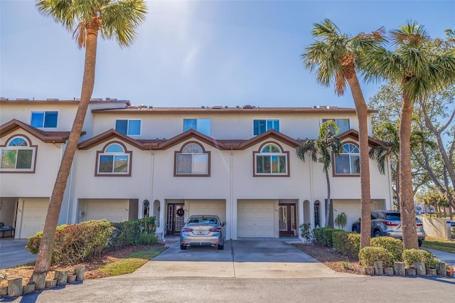 townhome / multi-family property featuring a garage