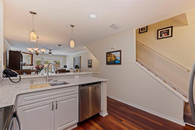 kitchen featuring white cabinetry, ceiling fan, dishwasher, sink, and decorative light fixtures