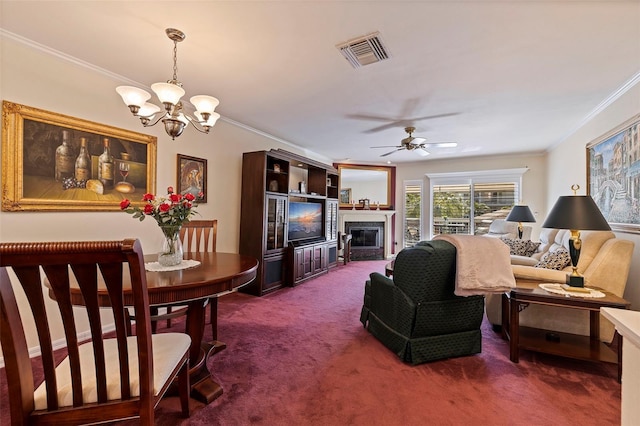 carpeted living room with ceiling fan with notable chandelier and ornamental molding