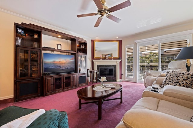 carpeted living room with crown molding and ceiling fan