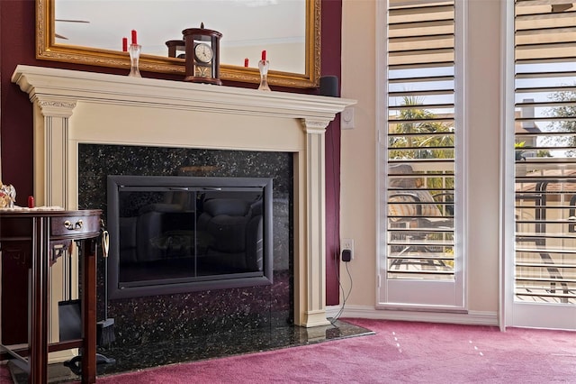 room details with carpet floors and a high end fireplace