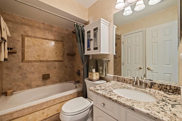 full bathroom featuring shower / bath combination with curtain, vanity, and toilet