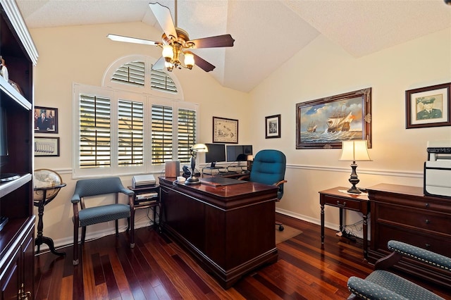 office featuring a textured ceiling, ceiling fan, dark wood-type flooring, and vaulted ceiling