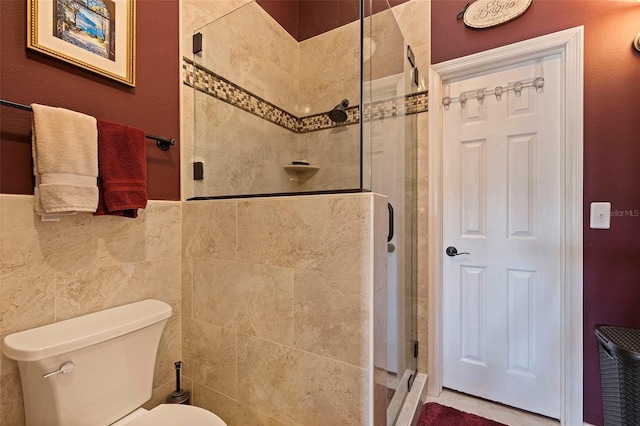 bathroom with toilet and walk in shower