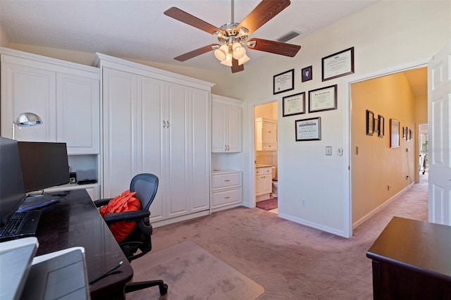 carpeted office space with ceiling fan and lofted ceiling