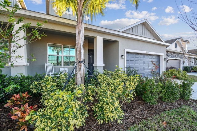 view of front of property featuring a porch and a garage