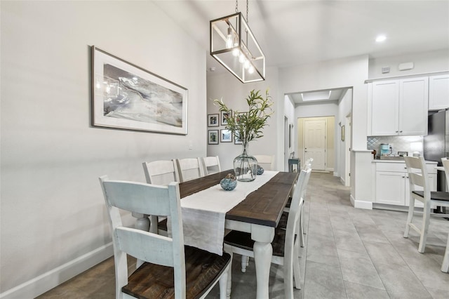 dining space featuring an inviting chandelier