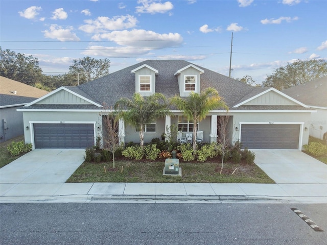 view of front facade with a porch and a garage