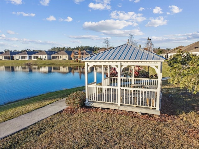 dock area featuring a residential view, a water view, and a gazebo