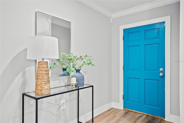 entryway with crown molding and hardwood / wood-style floors