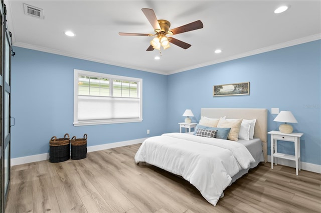 bedroom featuring ceiling fan, light hardwood / wood-style flooring, and crown molding