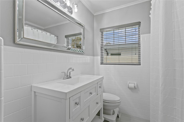 bathroom with crown molding, vanity, and tile walls