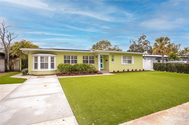 ranch-style house with a front lawn