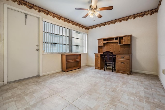 unfurnished office with ceiling fan