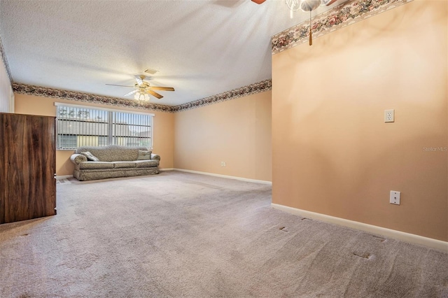 unfurnished living room featuring carpet flooring, a textured ceiling, and ceiling fan