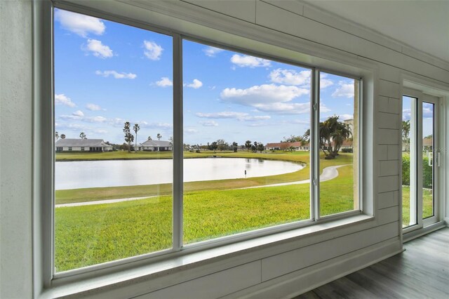 interior space featuring a water view and a healthy amount of sunlight