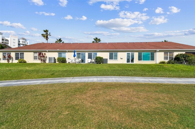 single story home featuring a front lawn and central AC unit