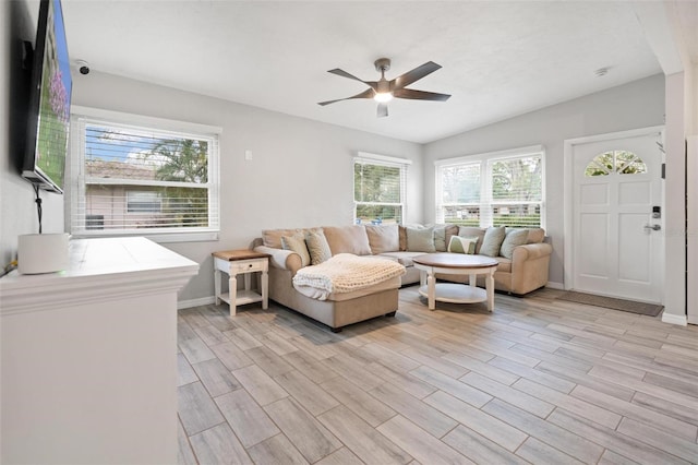 living room with light hardwood / wood-style flooring and ceiling fan