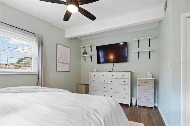 bedroom featuring beam ceiling, ceiling fan, and dark hardwood / wood-style flooring