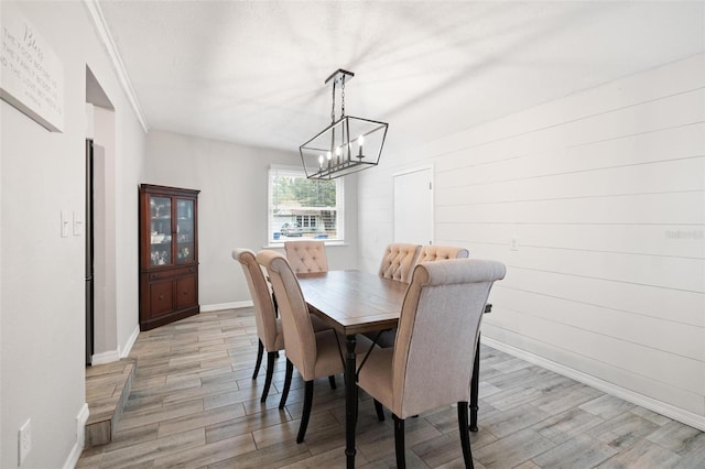 dining room featuring light hardwood / wood-style floors and a notable chandelier