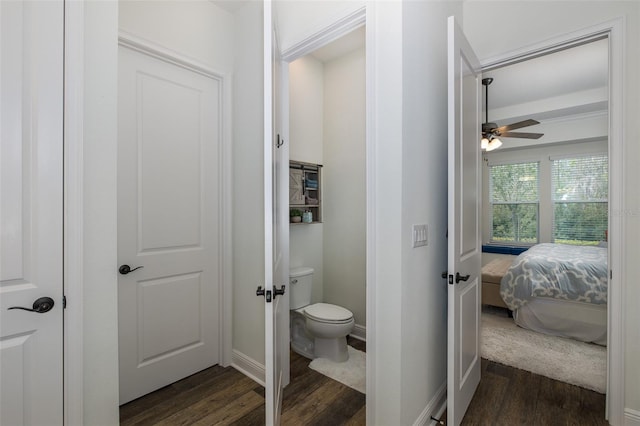 bathroom with hardwood / wood-style floors, ceiling fan, and toilet