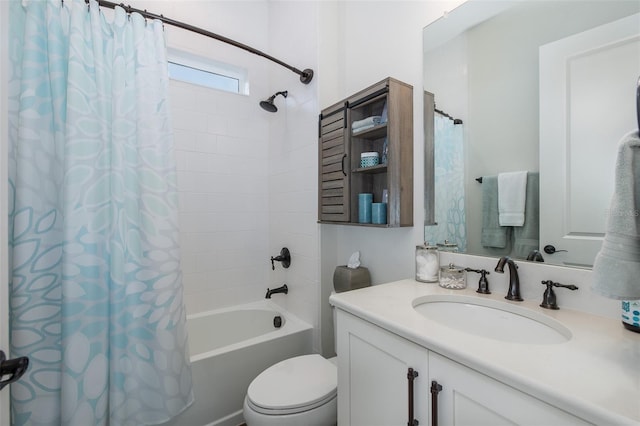 full bathroom featuring shower / bath combo with shower curtain, vanity, and toilet