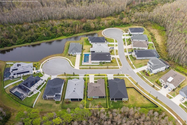 birds eye view of property featuring a water view