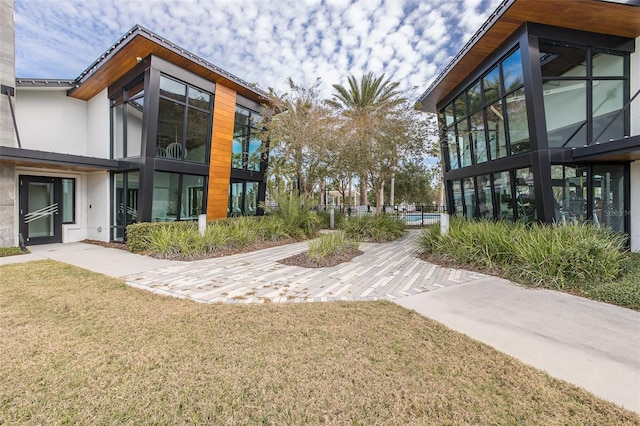 view of community featuring a lawn