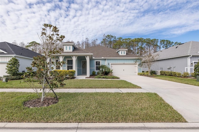 view of front facade with a garage and a front lawn