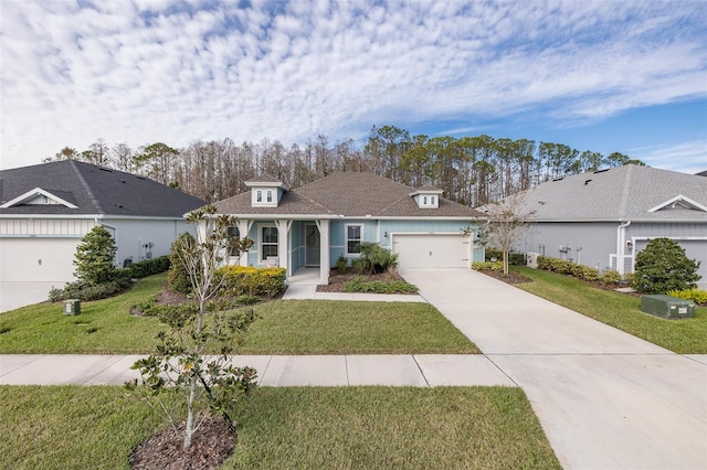 ranch-style home with a garage and a front yard