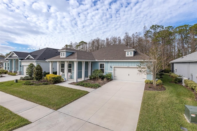 single story home with a porch, a garage, and a front lawn