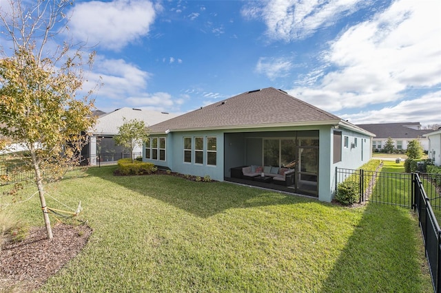 back of property featuring a sunroom, a yard, and outdoor lounge area