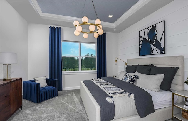 carpeted bedroom featuring a raised ceiling, crown molding, and a notable chandelier