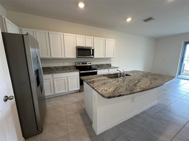 kitchen featuring white cabinets, sink, a kitchen island with sink, and appliances with stainless steel finishes