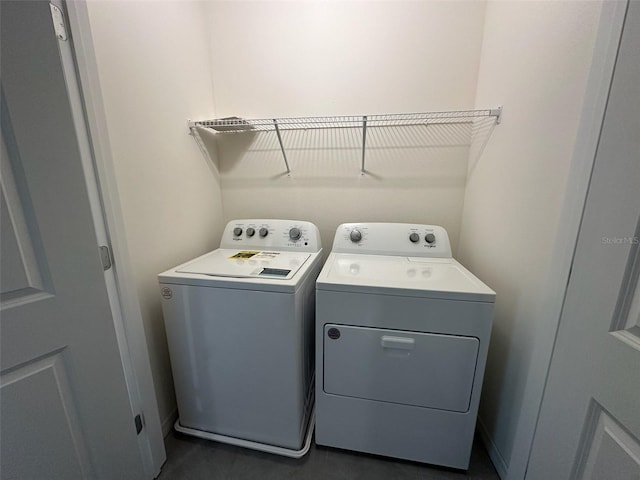 laundry area with separate washer and dryer