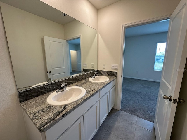 bathroom featuring tile patterned floors and vanity