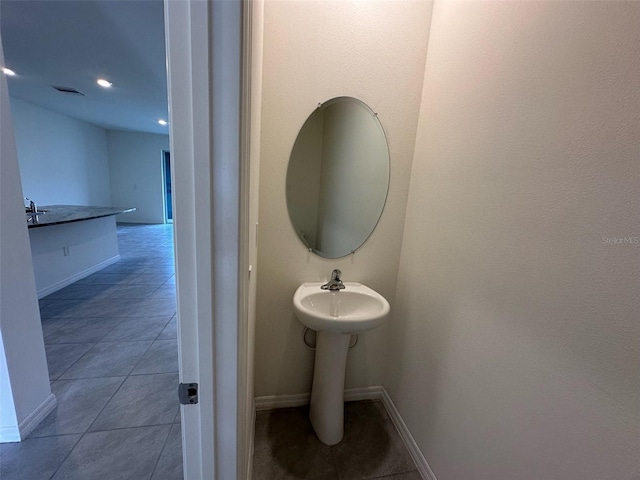 bathroom featuring tile patterned floors and sink