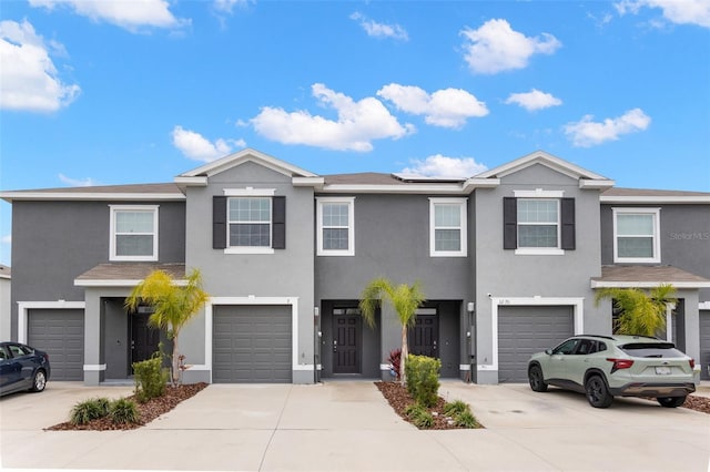 multi unit property with a garage and solar panels