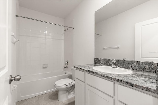 full bathroom with vanity, toilet, tiled shower / bath combo, and tile patterned flooring