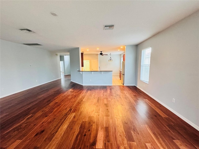 unfurnished living room featuring wood-type flooring