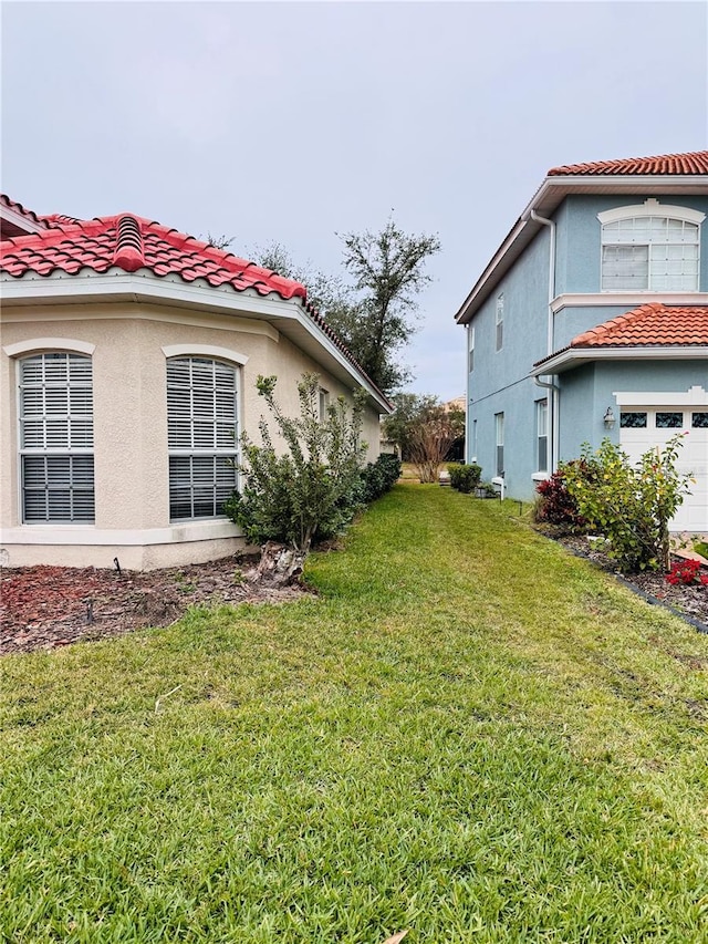 view of yard featuring a garage