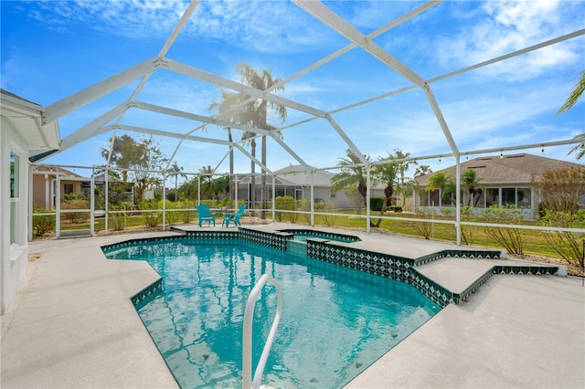 view of swimming pool with glass enclosure, an in ground hot tub, and a patio