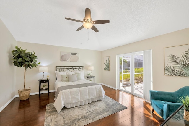 bedroom with access to exterior, a textured ceiling, dark hardwood / wood-style floors, and ceiling fan