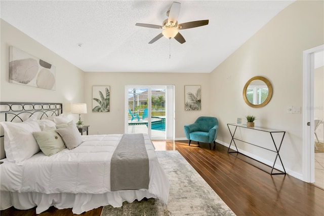 bedroom featuring a textured ceiling, access to outside, ceiling fan, and dark hardwood / wood-style floors