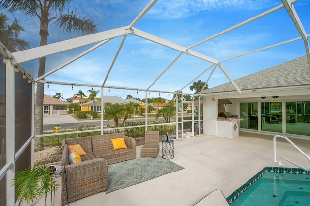 view of pool with a patio, glass enclosure, and an outdoor hangout area