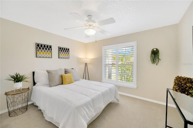 bedroom with light carpet and ceiling fan